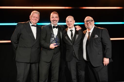Grant McDonald (Print Manager at Saica Pack) middle left and Peter Kempston (Plant Manager at Saica Pack) middle right collecting one of the Gold awards on the night.